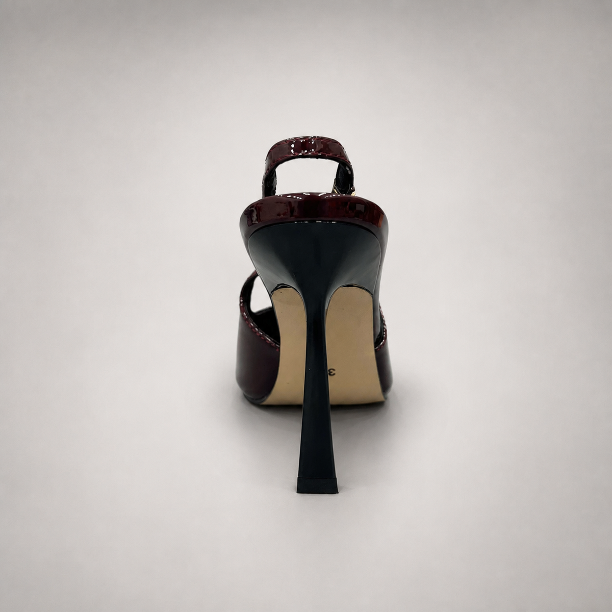 Burgundy slingback pump rear view showing a pointed toe