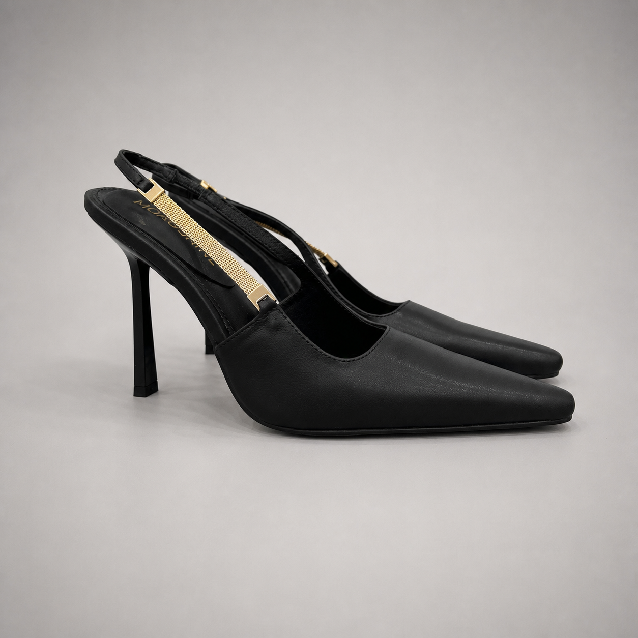 Black slingback pump pair three-quarter view showing a pointed toe