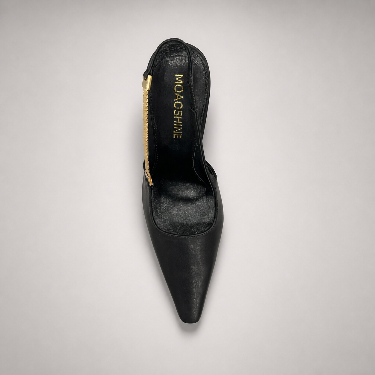 Black slingback pump outsole view showing the cow leather outsole