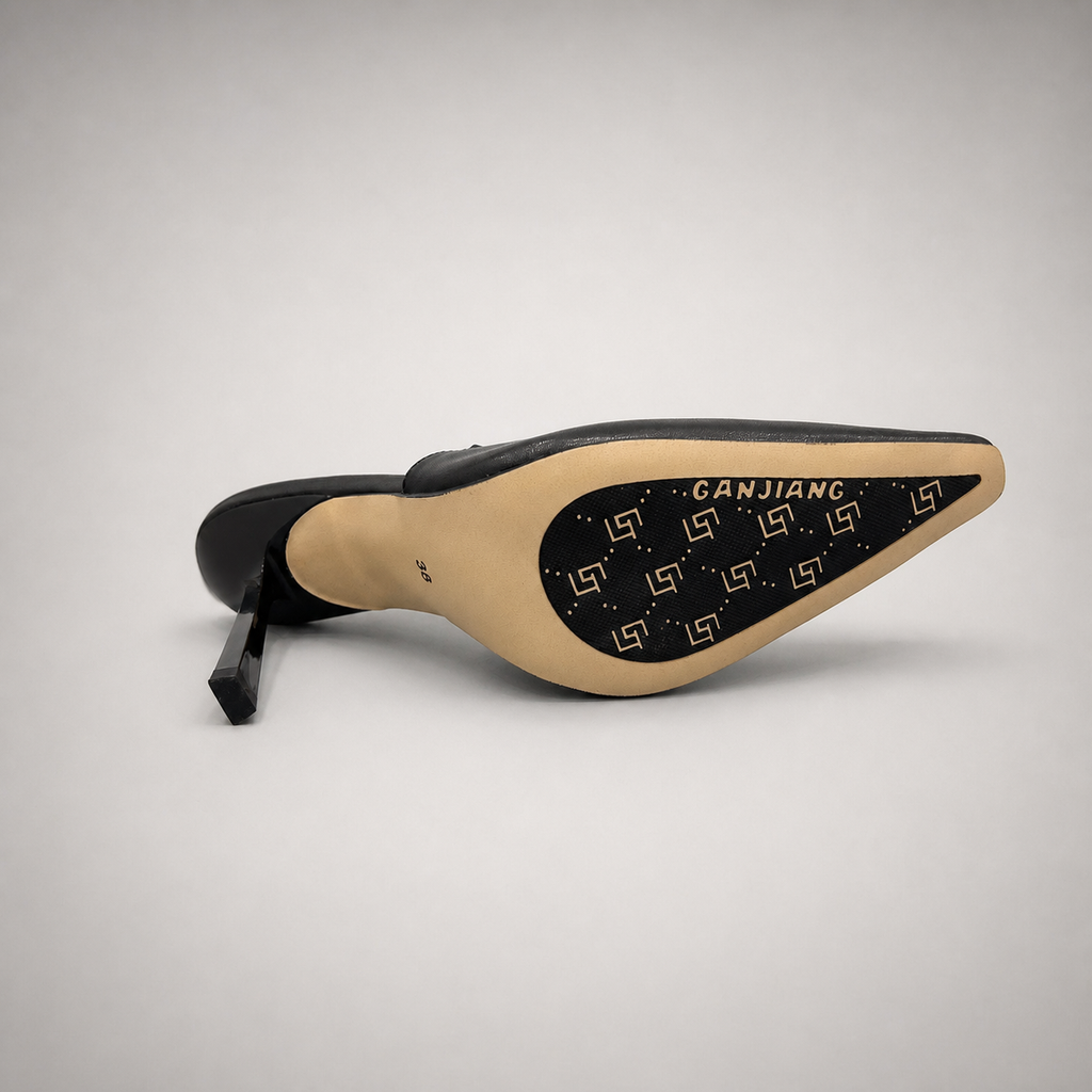 Black slingback pump top view showing a pointed toe