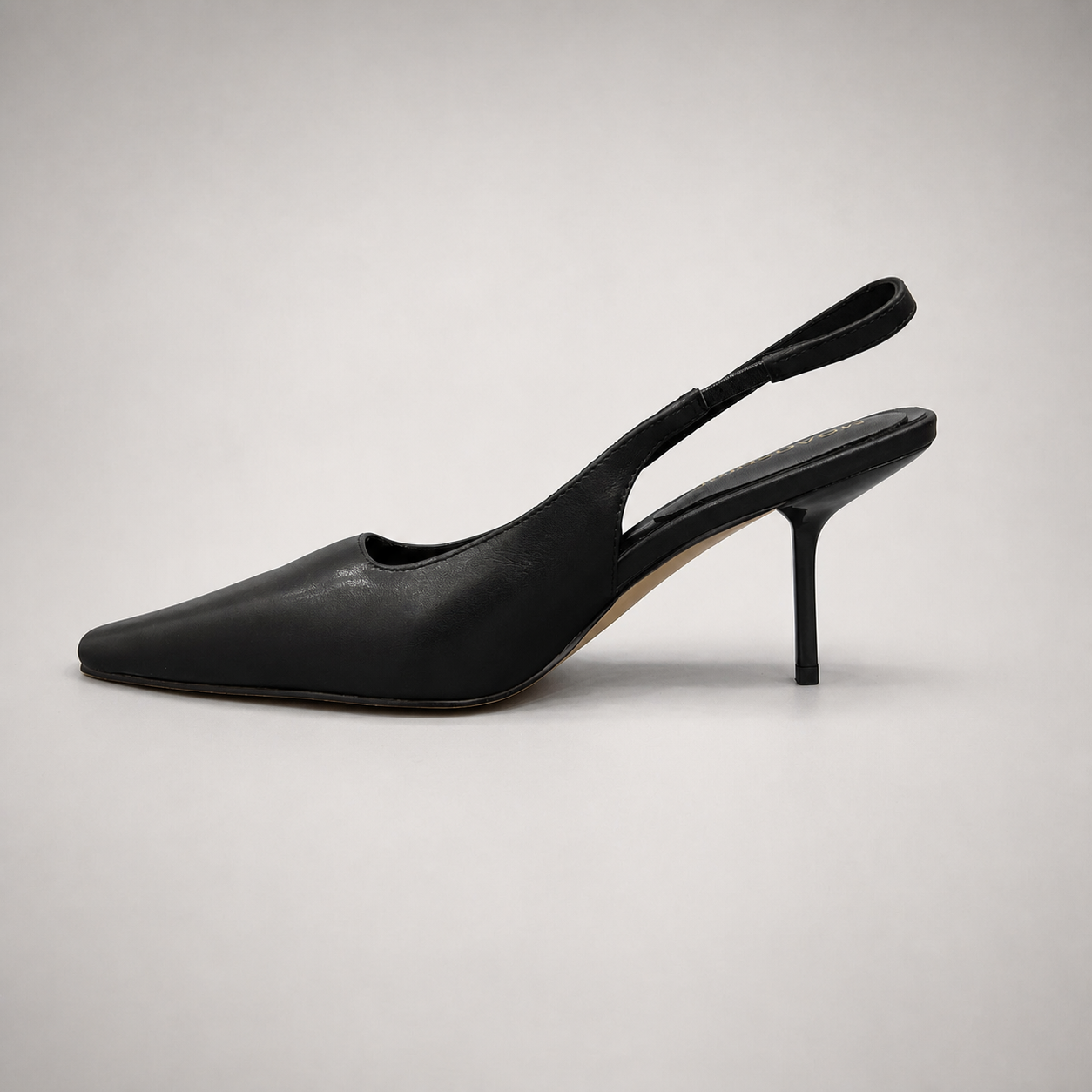 Black slingback pump opposite side profile showing a pointed toe
