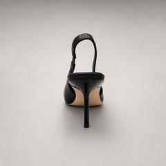 Black slingback pump rear view showing a pointed toe