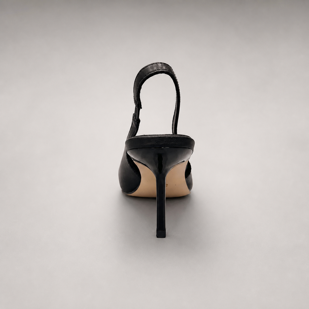 Black slingback pump rear view showing a pointed toe