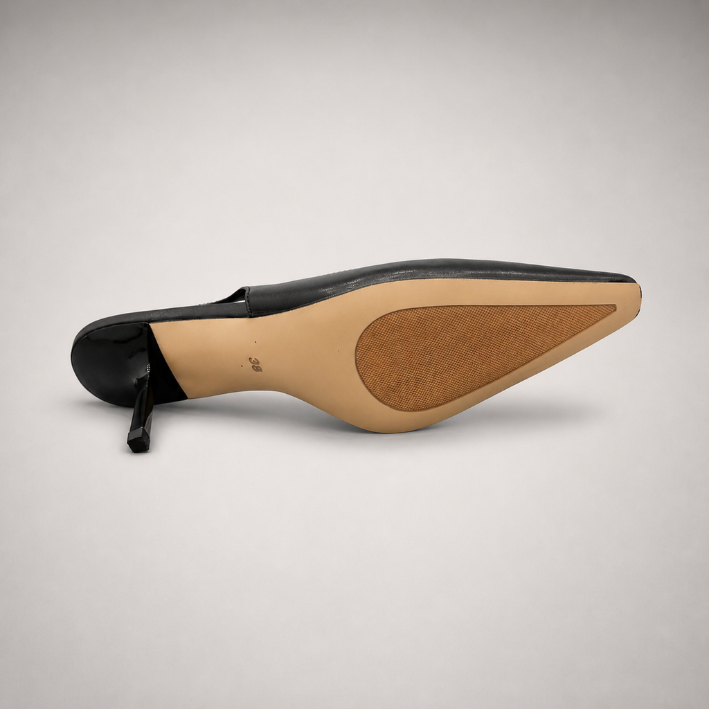 Black slingback pump outsole view showing the cow leather outsole
