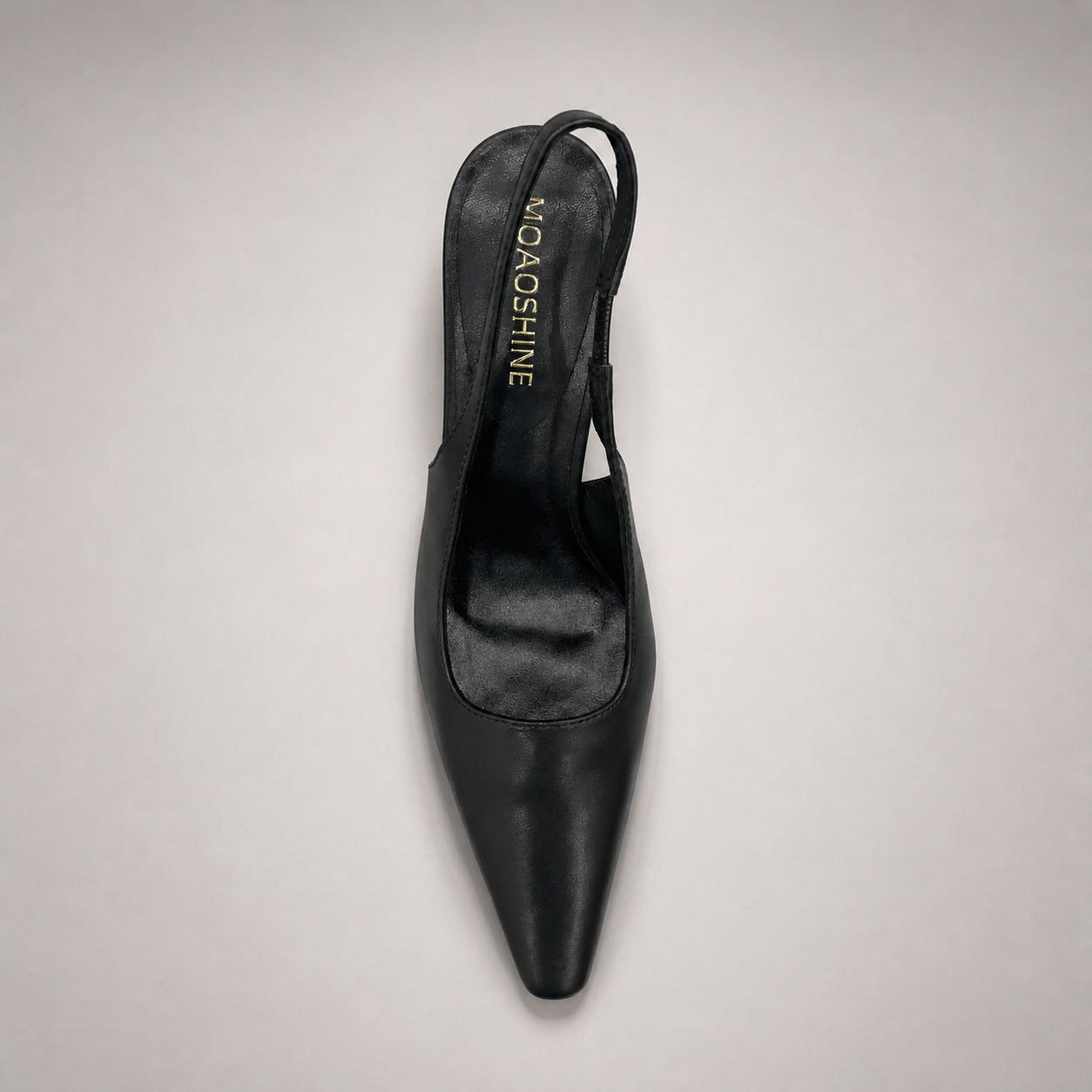 Black slingback pump top view showing a pointed toe