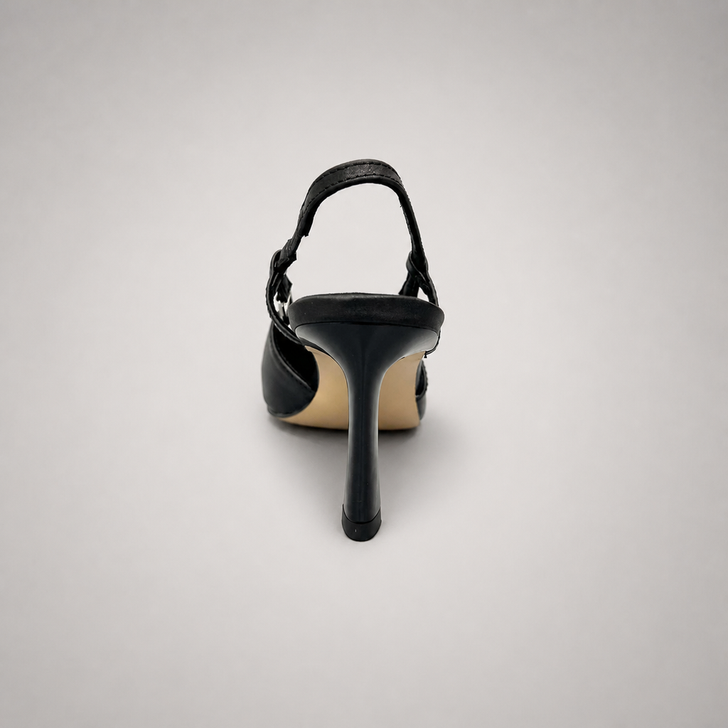 Black slingback pump rear view showing a pointed toe and double slingback straps
