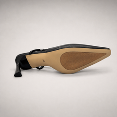 Black slingback pump outsole view showing the cow leather outsole