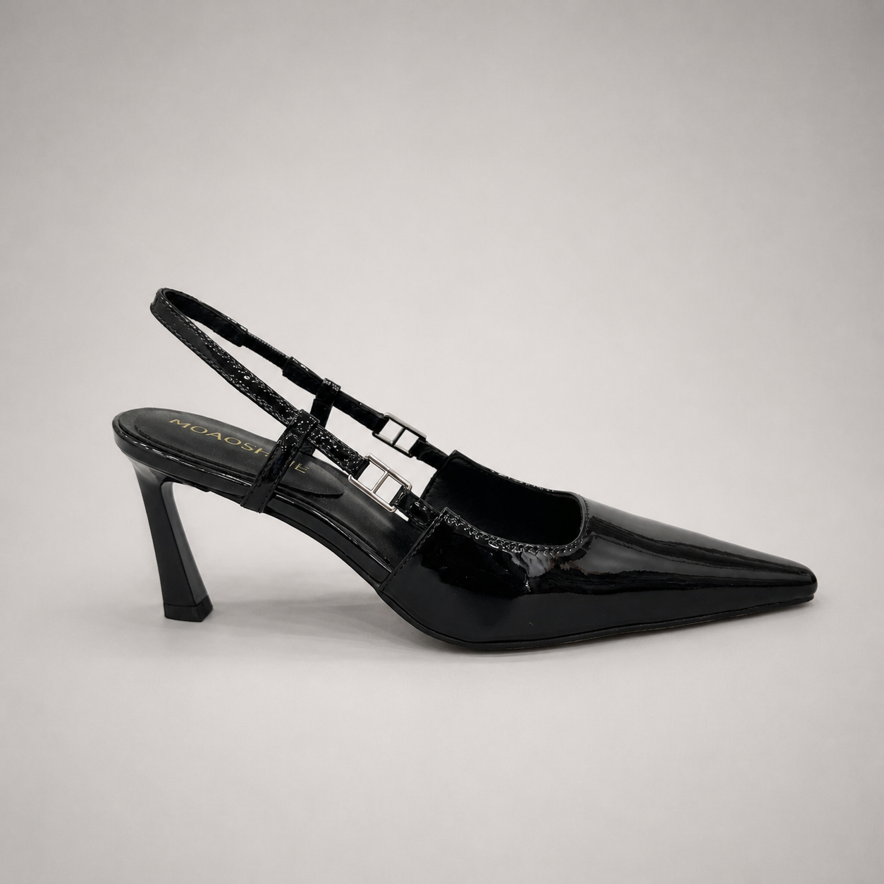 Black slingback pump side profile showing a pointed toe and double slingback straps
