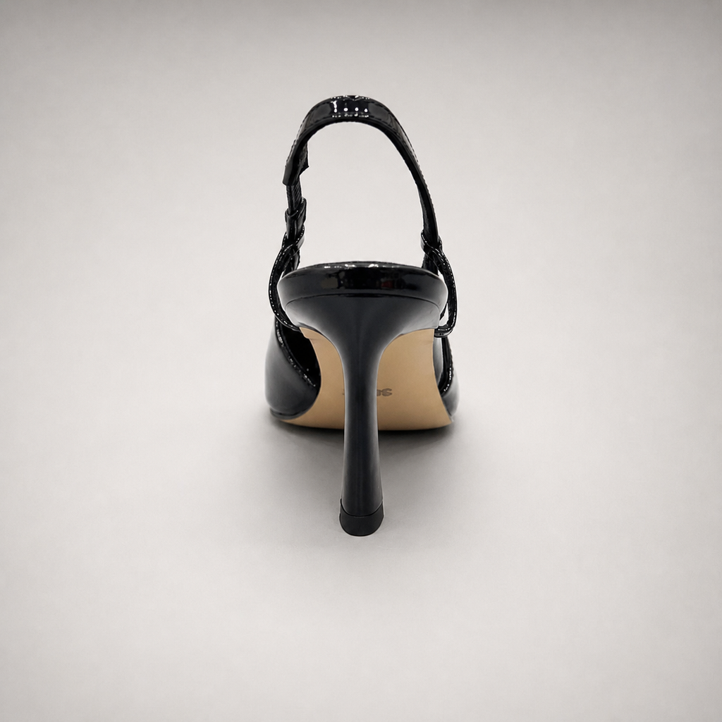 Black slingback pump rear view showing a pointed toe and double slingback straps
