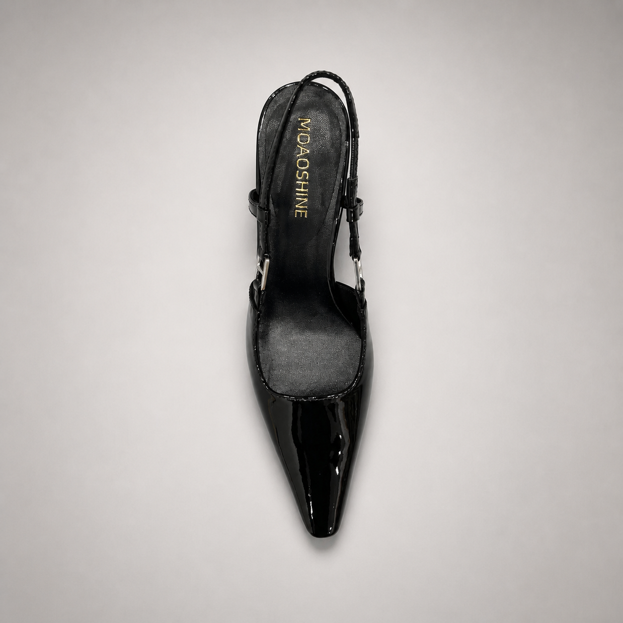 Black slingback pump top view showing a pointed toe and double slingback straps