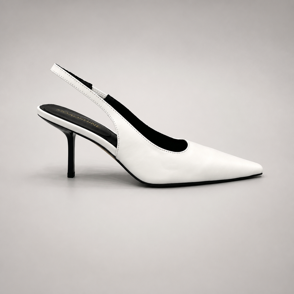 White slingback pump side profile showing a pointed toe, angular side cutout, and slingback strap