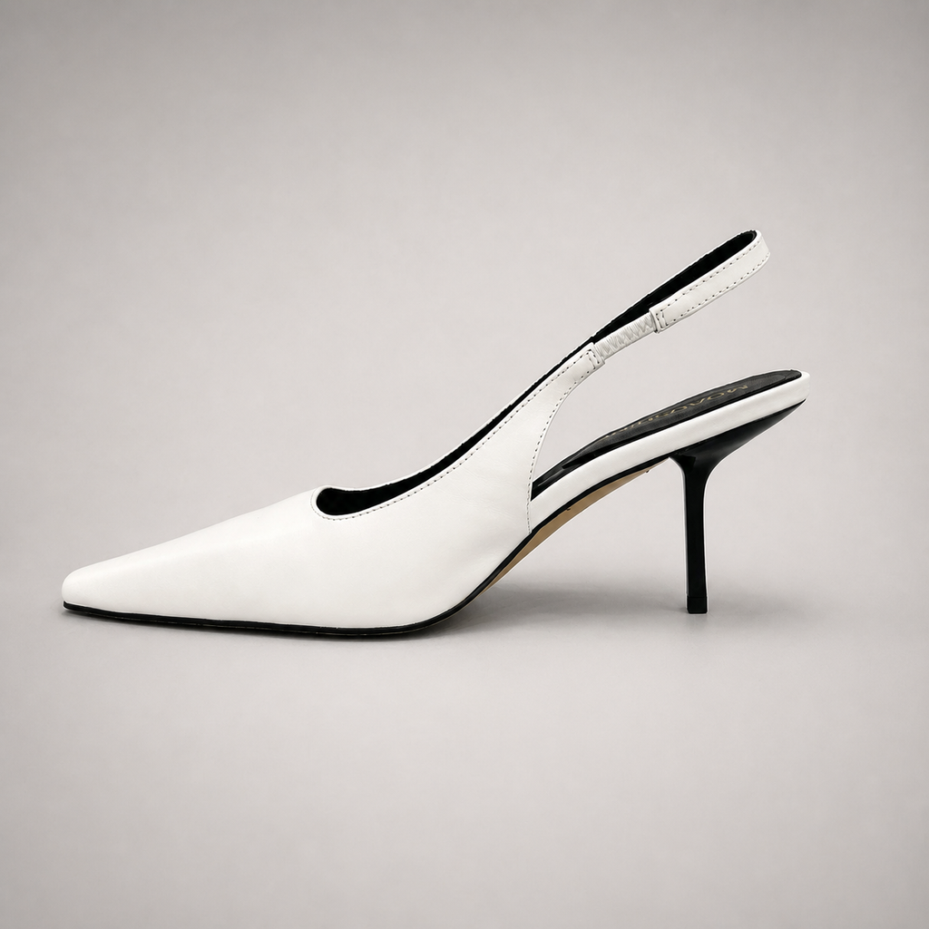 White slingback pump opposite side profile showing a pointed toe, angular side cutout, and slingback strap