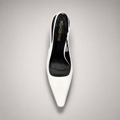 White slingback pump top view showing a pointed toe, angular side cutout, and slingback strap
