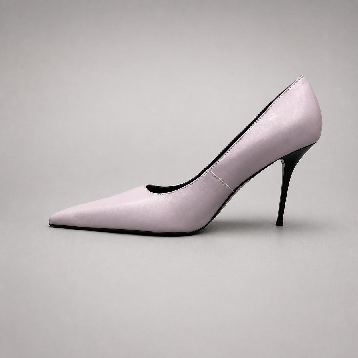 Pink pump opposite side profile showing a pointed toe