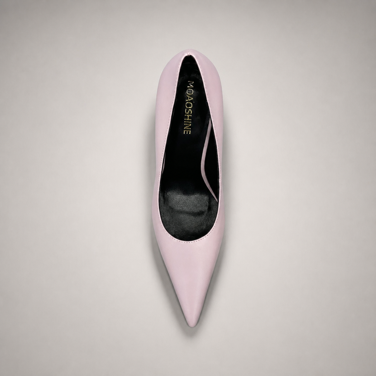 Pink pump top view showing a pointed toe