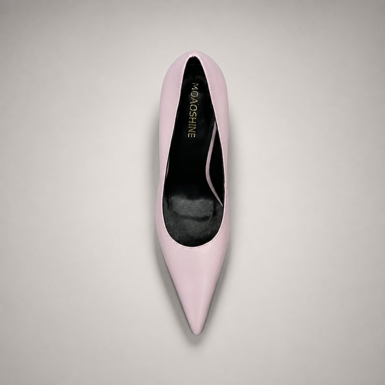 Pink pump top view showing a pointed toe