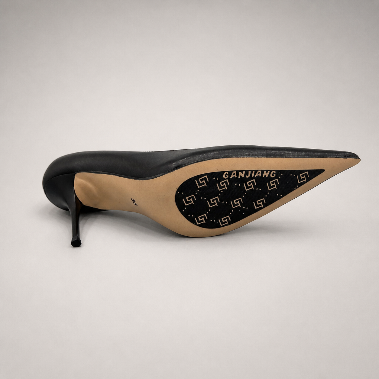 Black pump outsole view showing the cow leather outsole