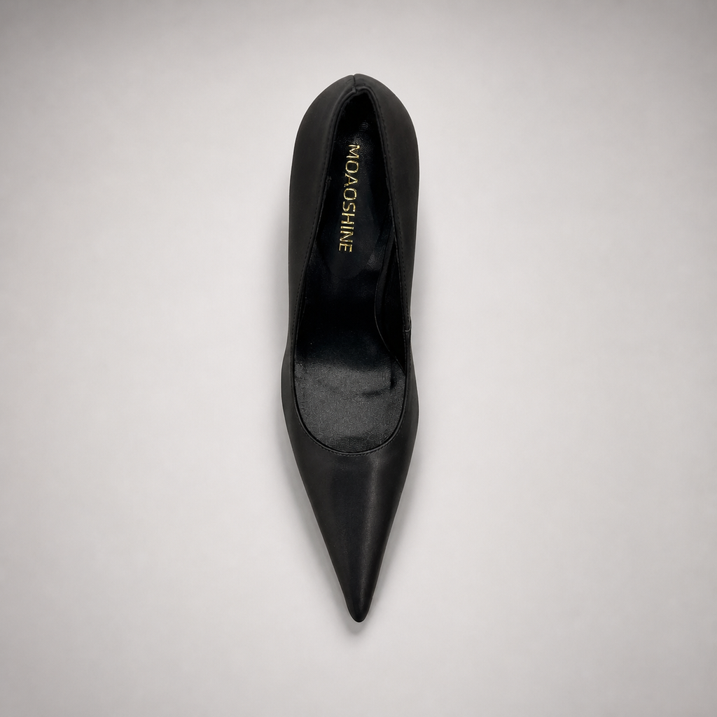 Black pump top view showing a pointed toe