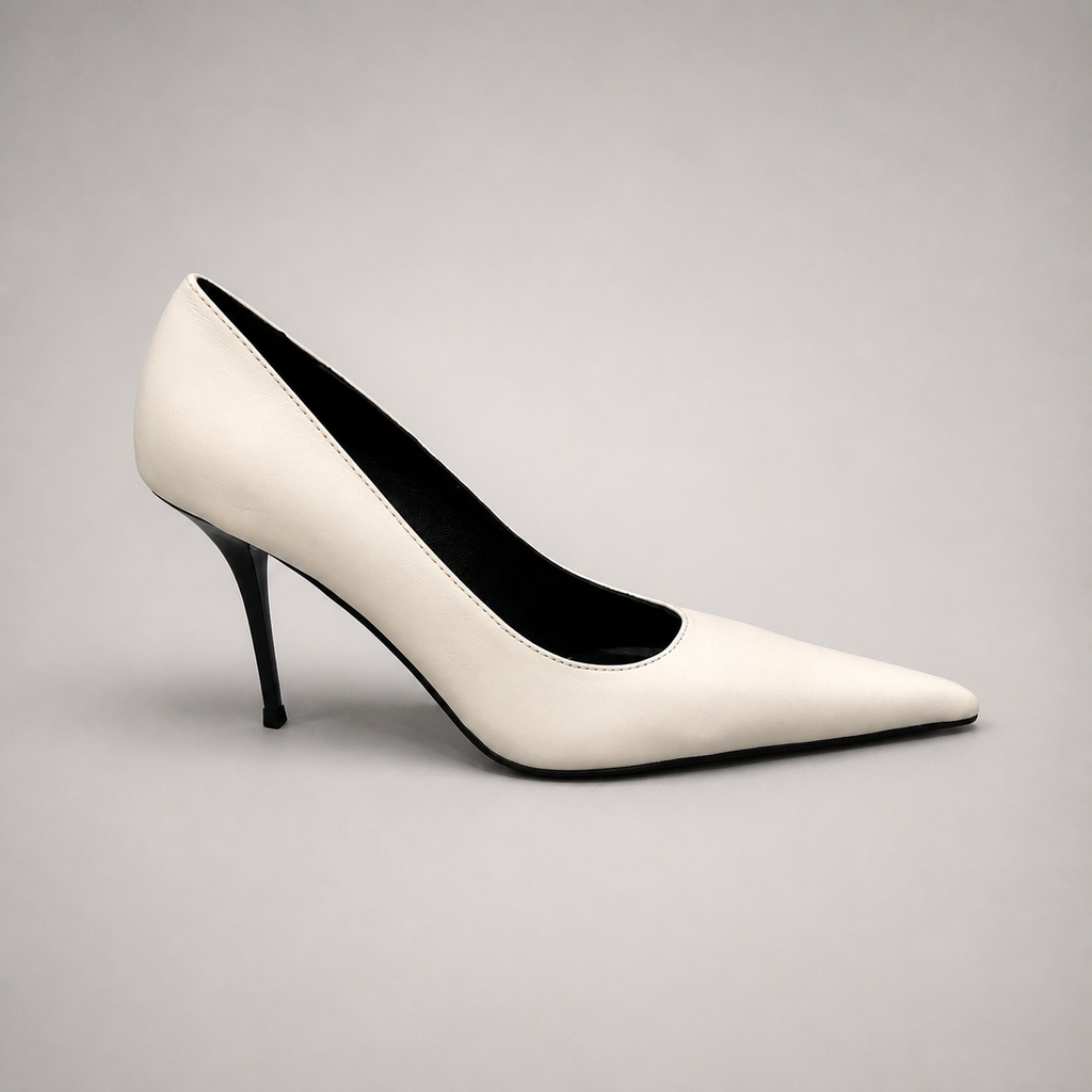 White pump side profile showing a pointed toe