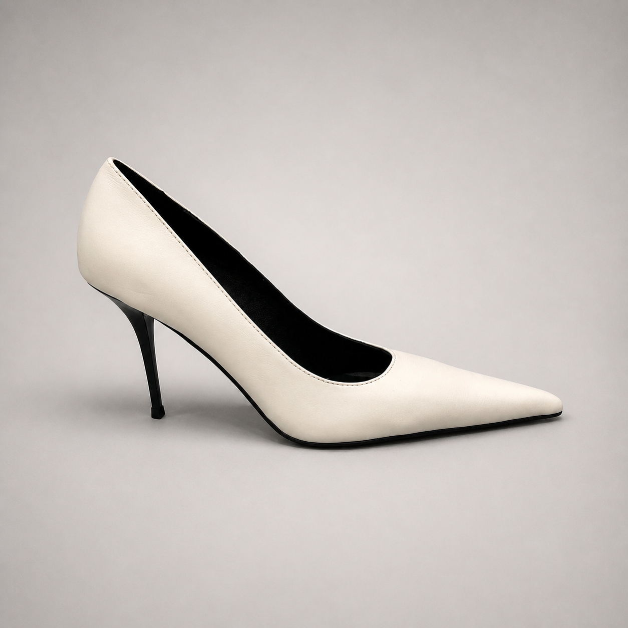 White pump side profile showing a pointed toe