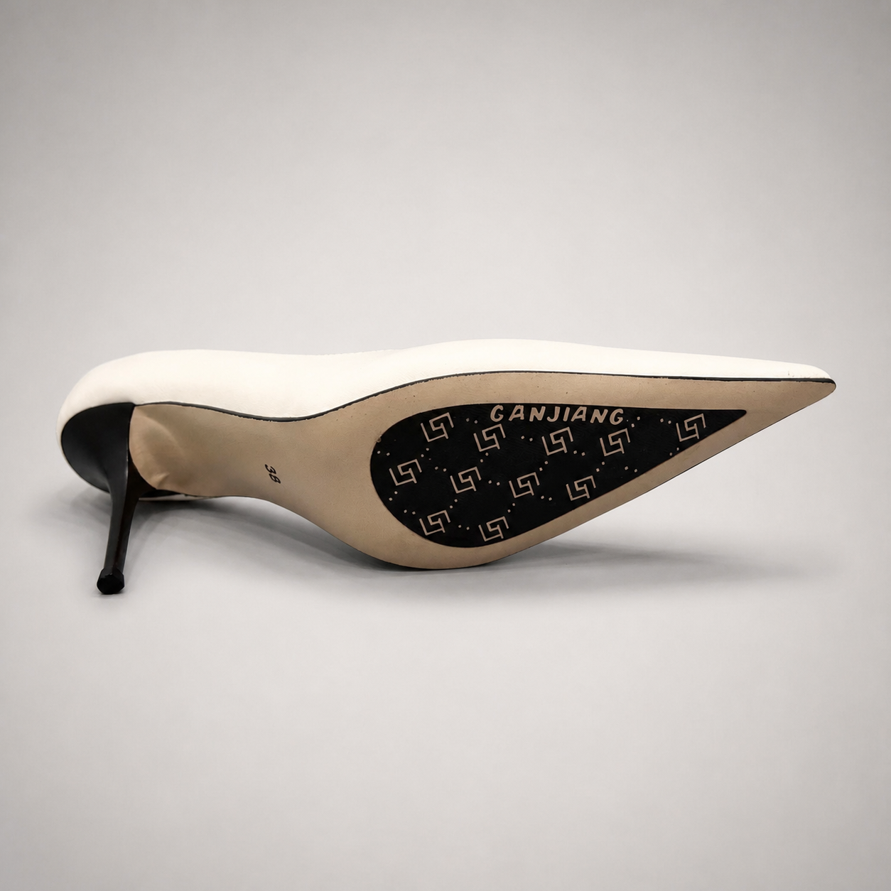 White pump top view showing a pointed toe