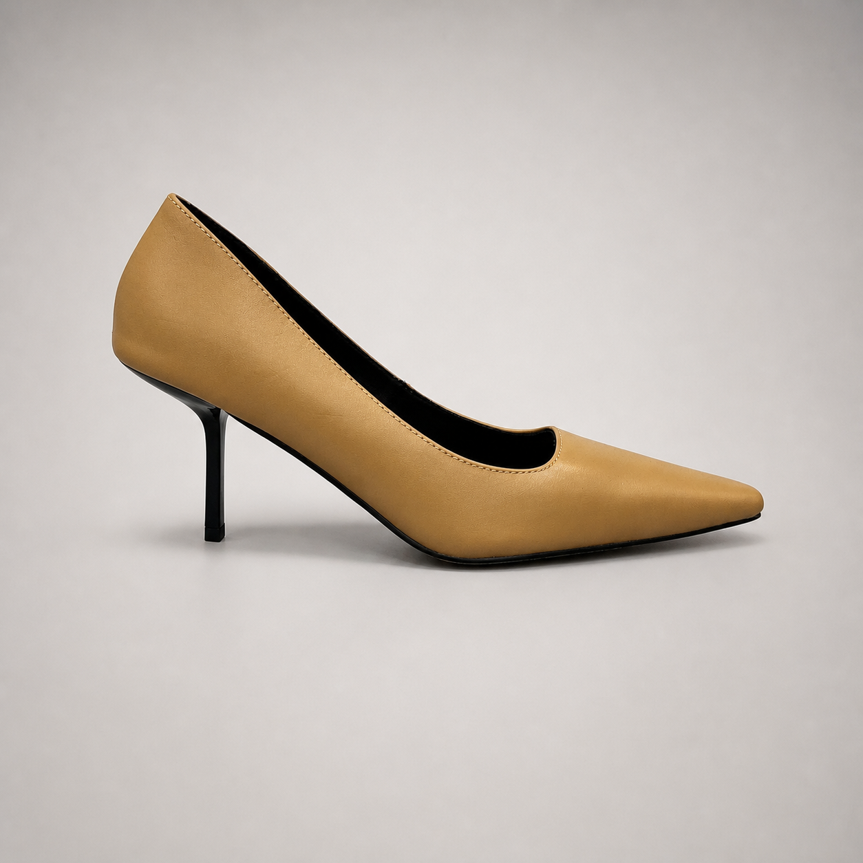 Tan pump side profile showing a pointed toe