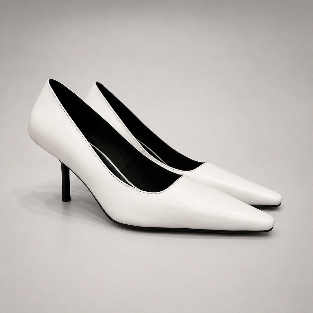 White pump pair three-quarter view showing a pointed toe