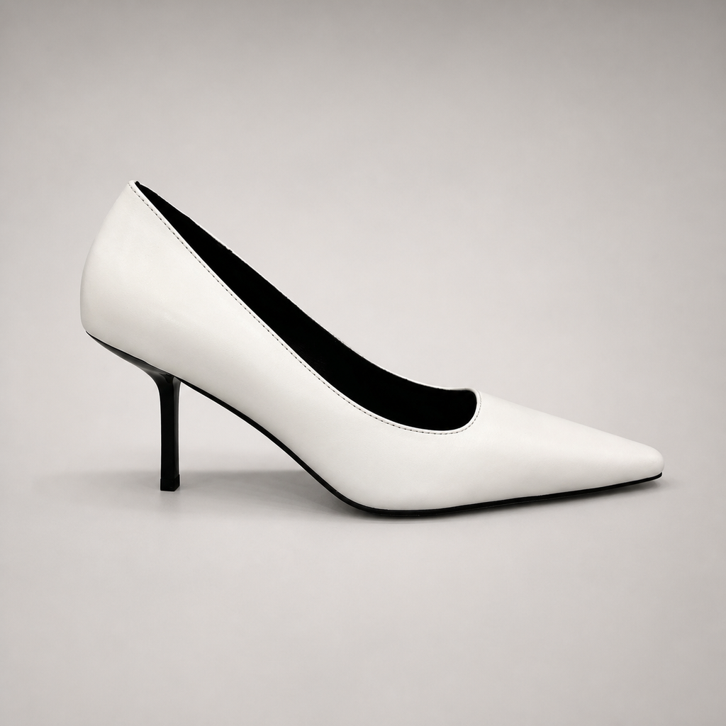 White pump side profile showing a pointed toe