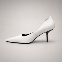 White pump opposite side profile showing a pointed toe