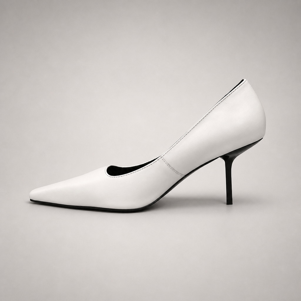 White pump opposite side profile showing a pointed toe