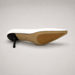 White pump top view showing a pointed toe