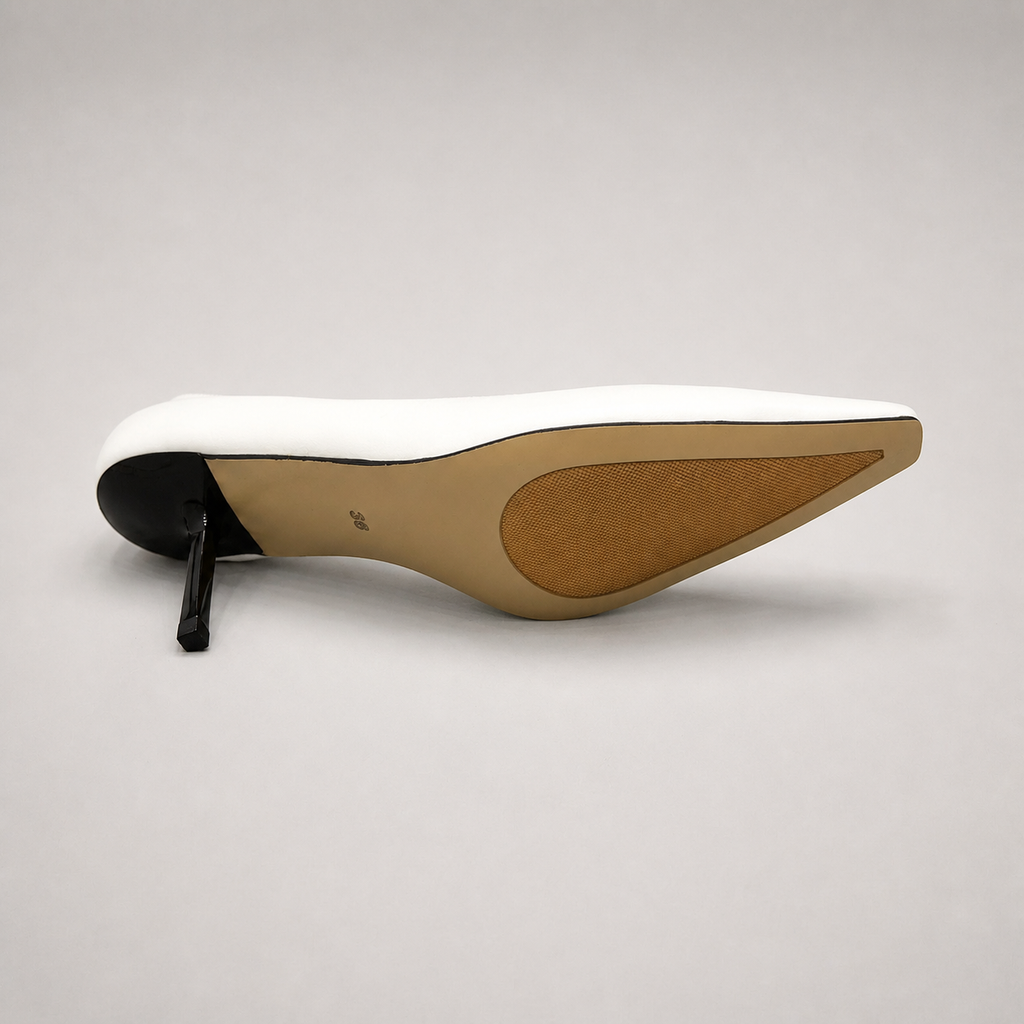 White pump top view showing a pointed toe