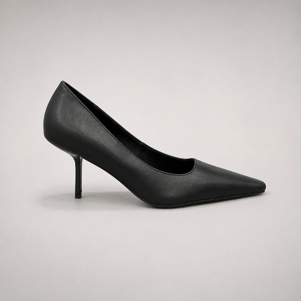 Black pump side profile showing a pointed toe
