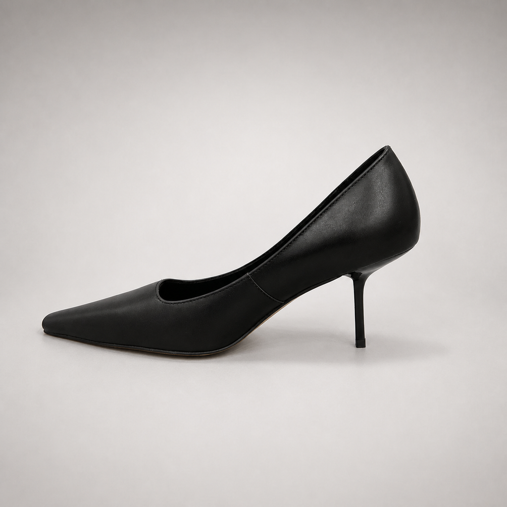 Black pump opposite side profile showing a pointed toe