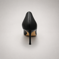 Black pump rear view showing a pointed toe