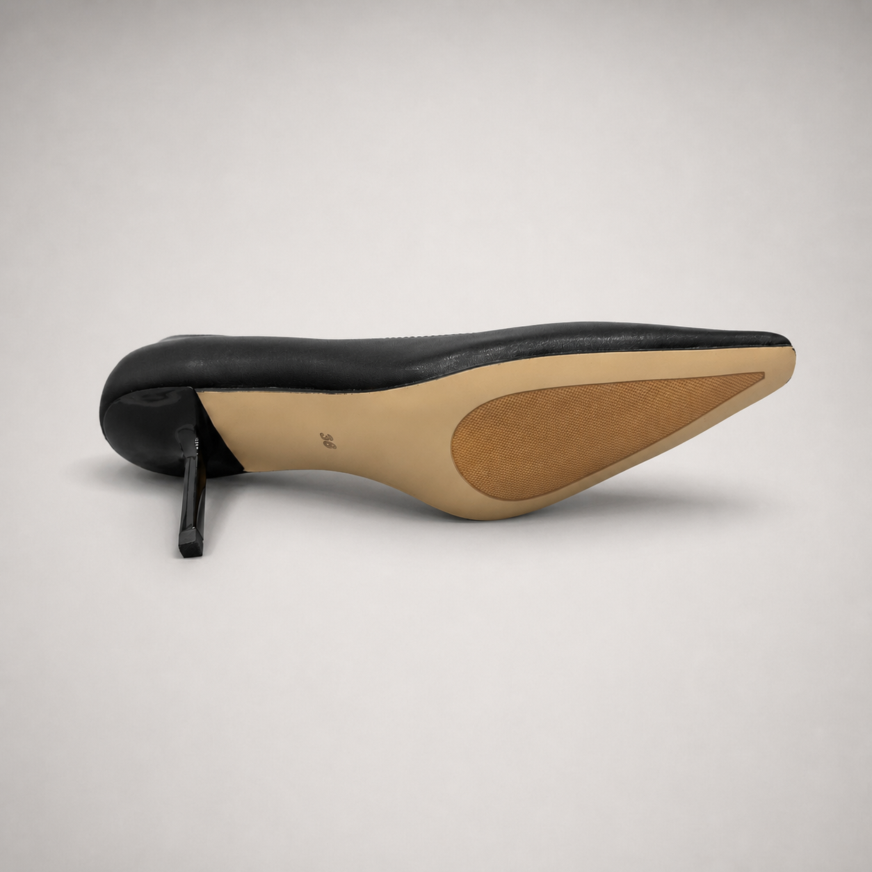 Black pump outsole view showing the cow leather outsole