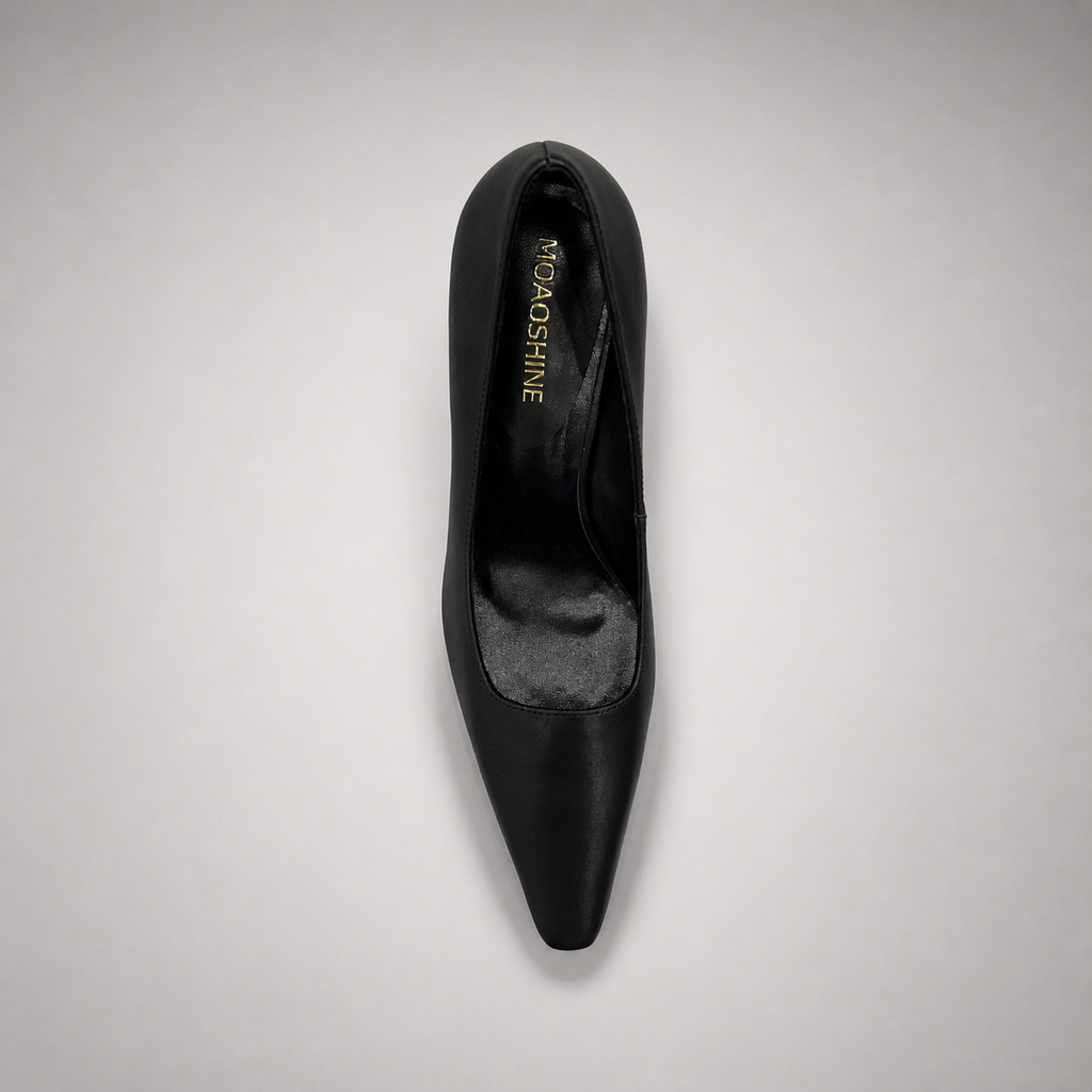 Black pump top view showing a pointed toe