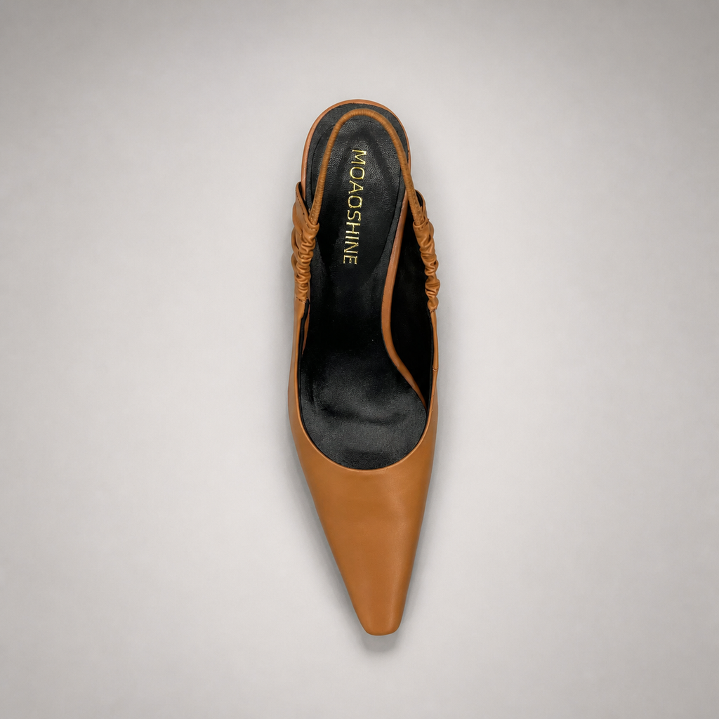 Tan slingback pump outsole view showing the cow leather outsole