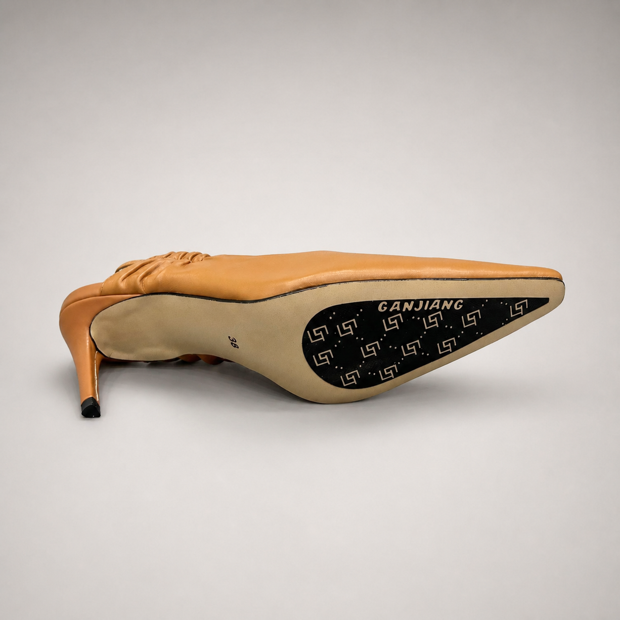Tan slingback pump top view showing a pointed toe and gathered slingback strap