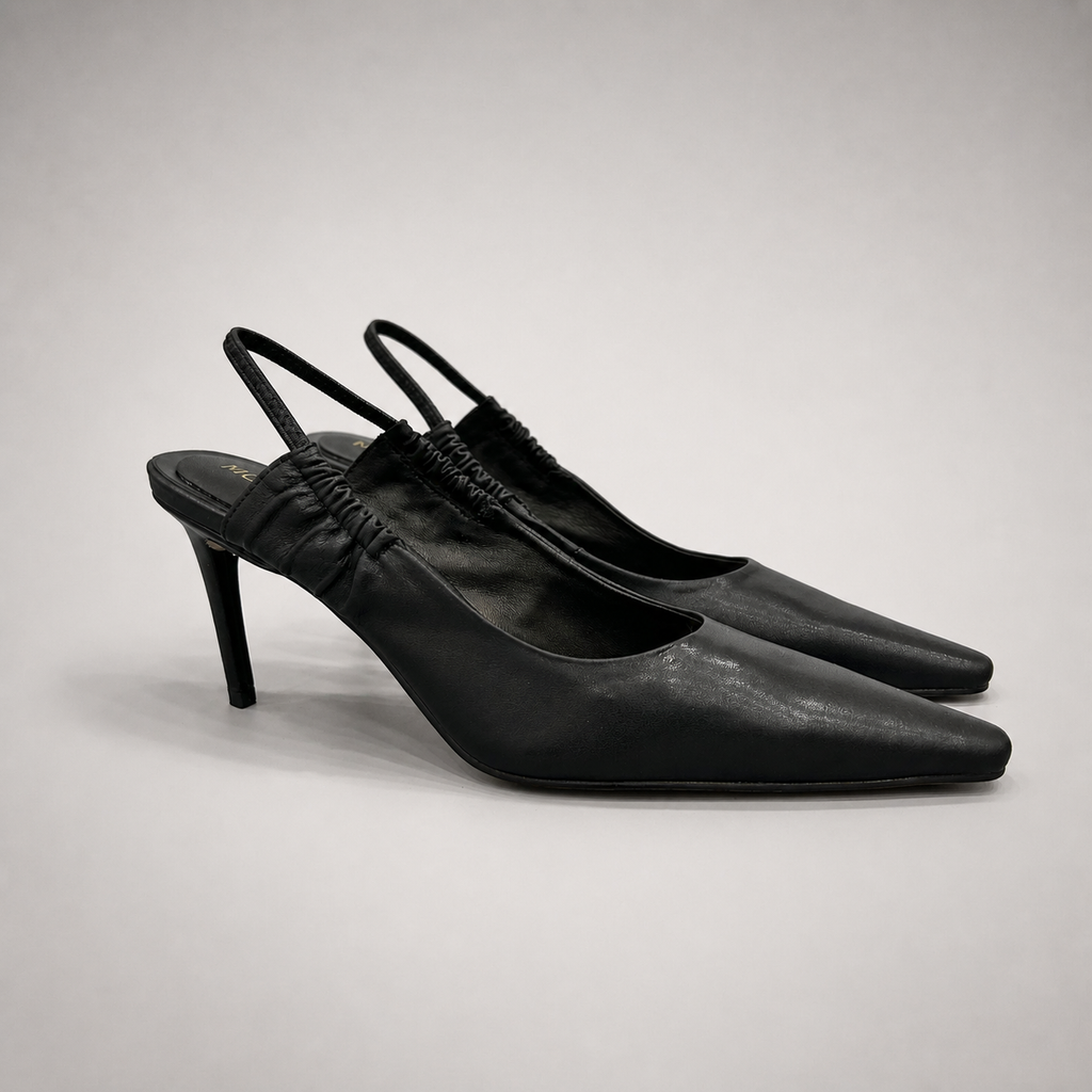 Black slingback pump pair three-quarter view showing a pointed toe