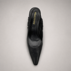 Black slingback pump top view showing a pointed toe