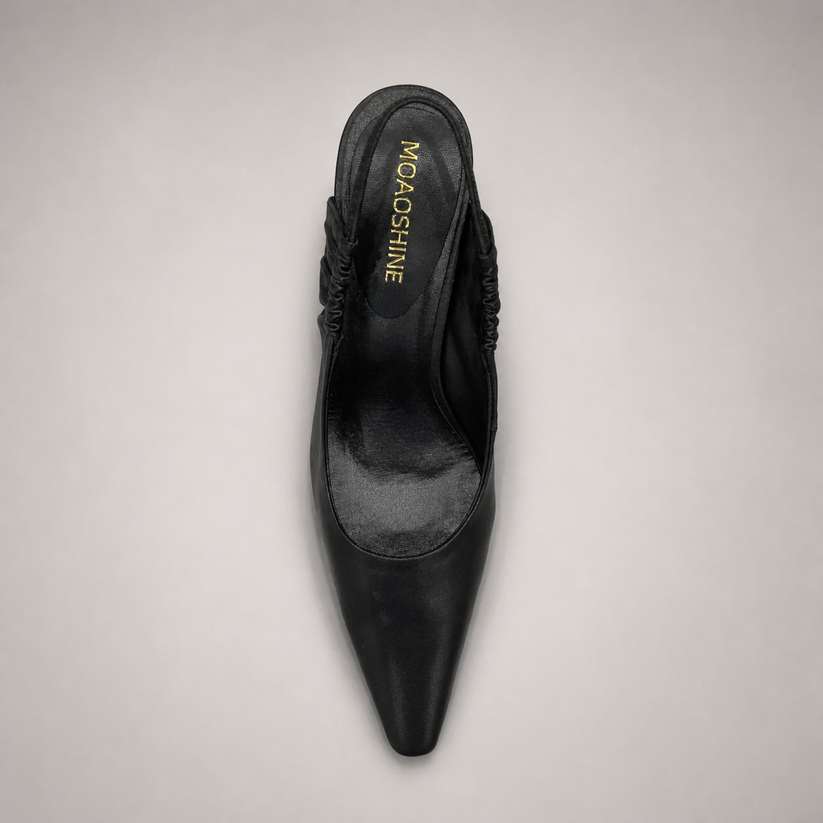 Black slingback pump top view showing a pointed toe