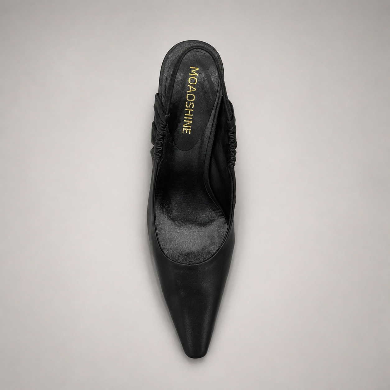 Black slingback pump top view showing a pointed toe