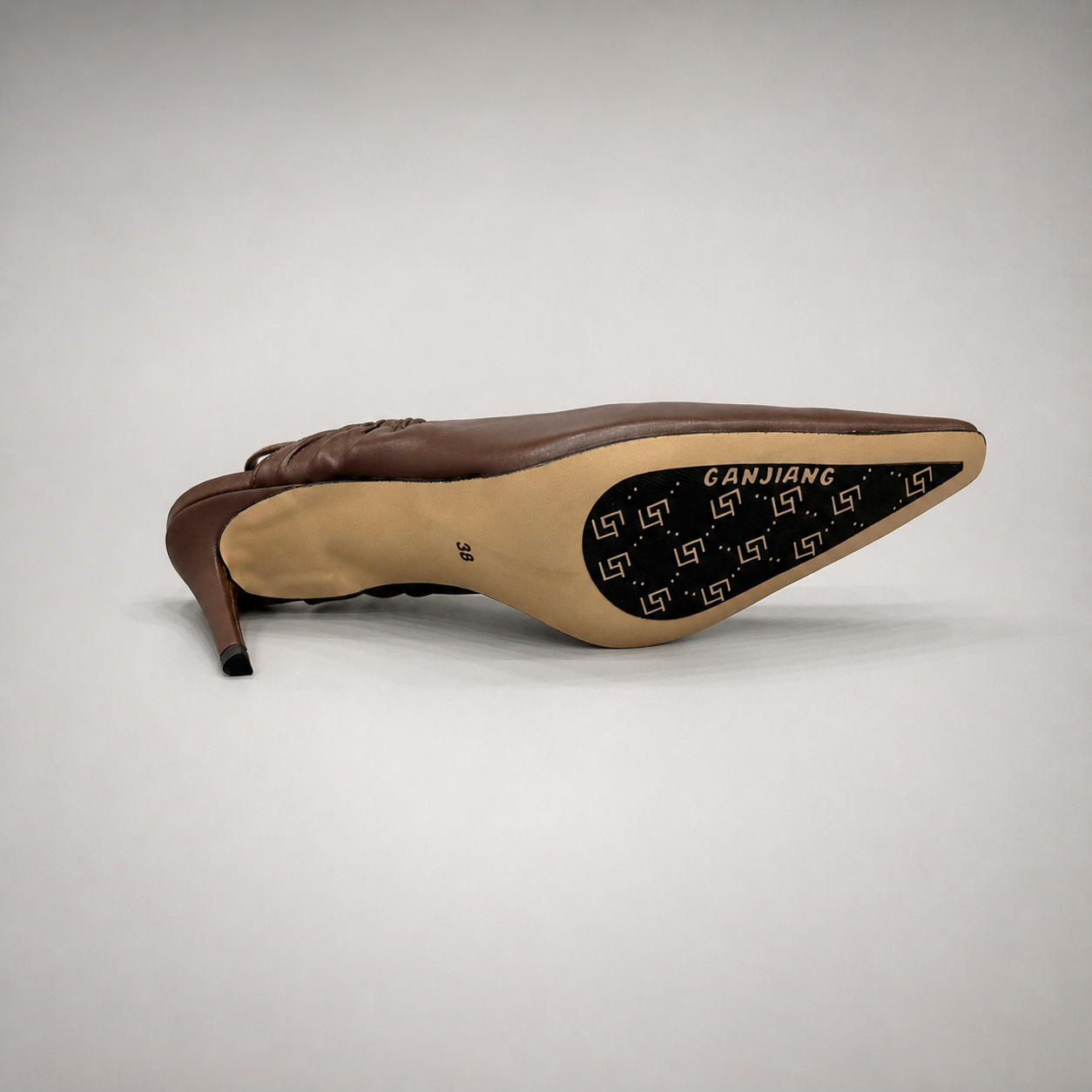 Brown slingback pump opposite side profile showing a pointed toe and gathered slingback strap
