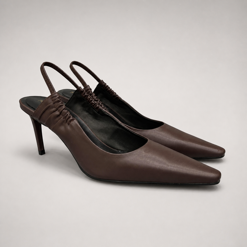 Brown slingback pump pair three-quarter view showing a pointed toe and gathered slingback strap