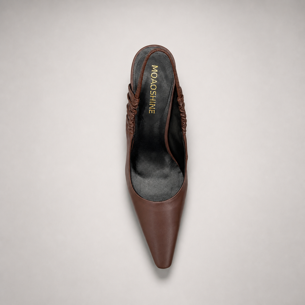Brown slingback pump outsole view showing the cow leather outsole