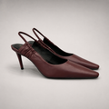 Burgundy slingback pump pair three-quarter view showing a pointed toe and gathered slingback strap