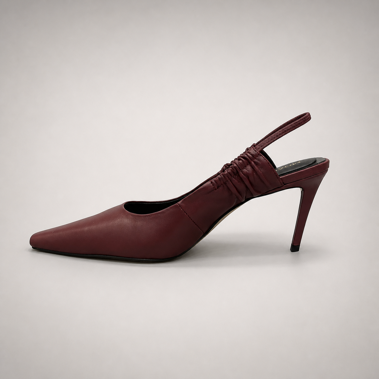 Burgundy slingback pump opposite side profile showing a pointed toe and gathered slingback strap