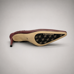 Burgundy slingback pump outsole view showing the cow leather outsole