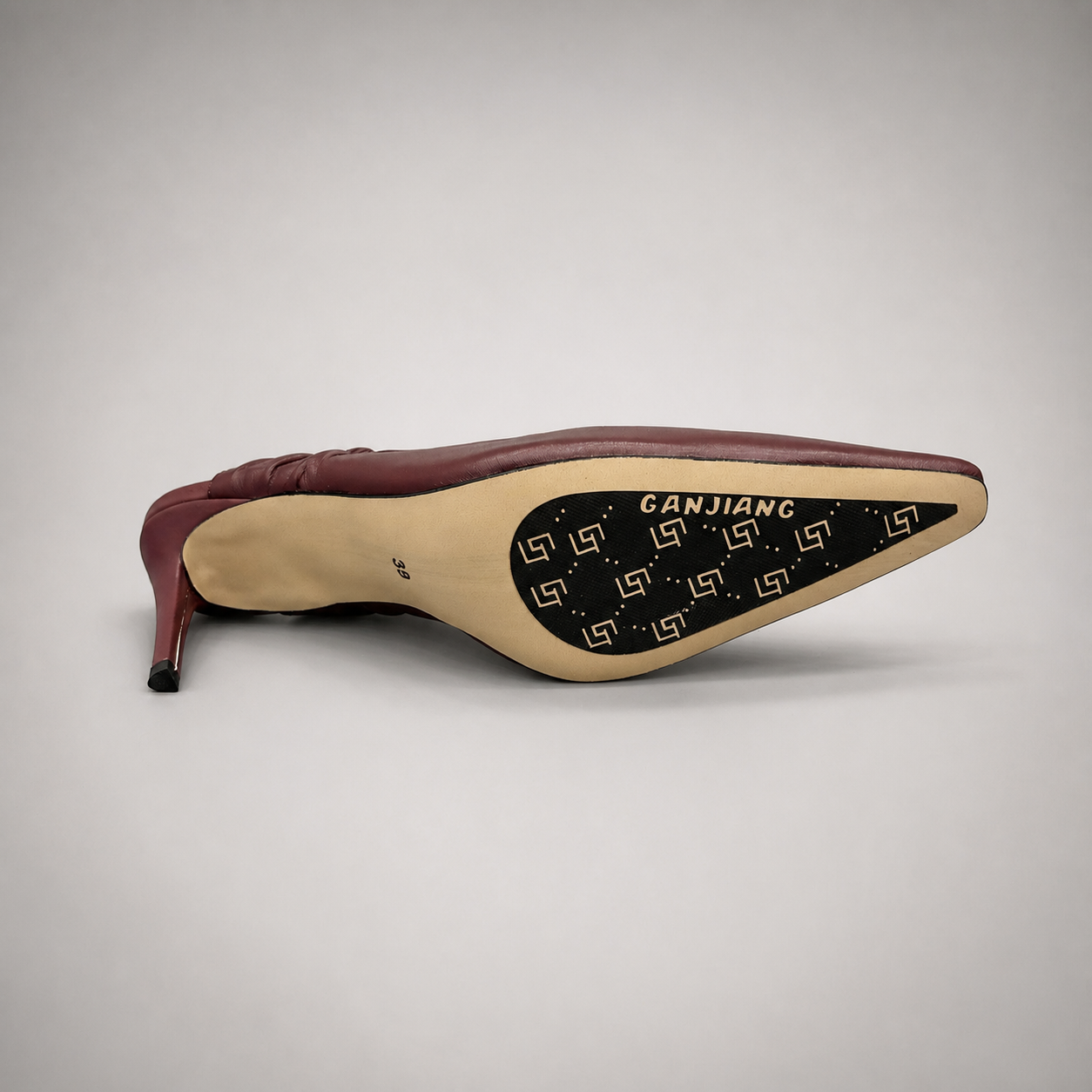 Burgundy slingback pump outsole view showing the cow leather outsole